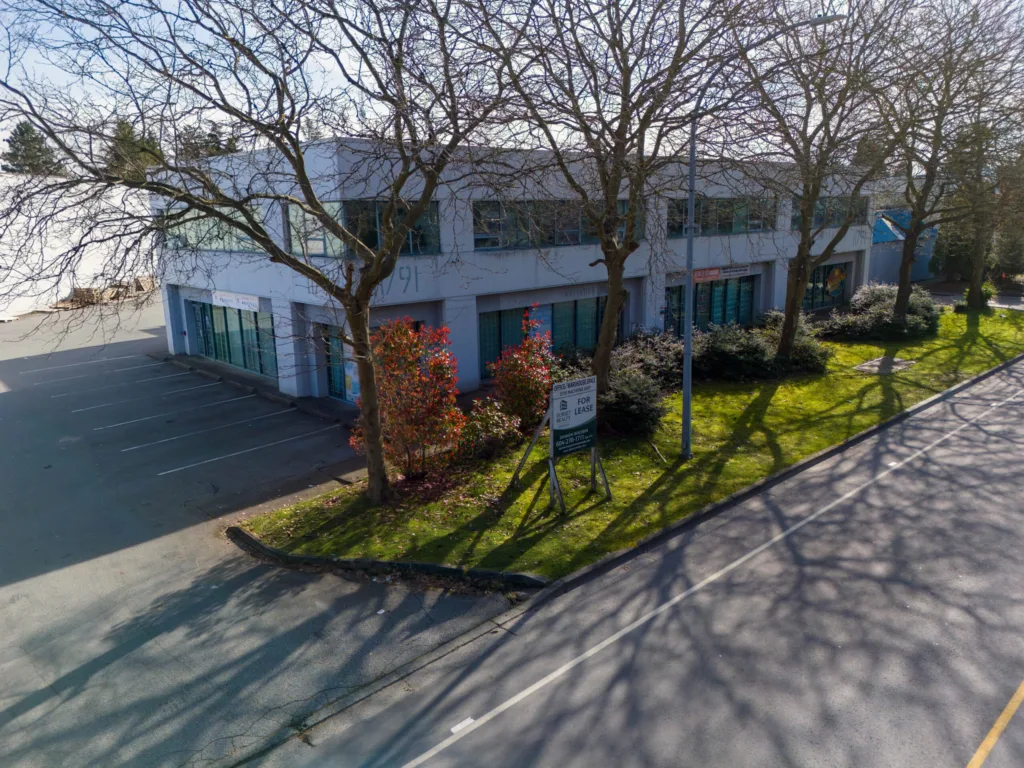 11791 Machrina Way street-level view with For Lease signage and landscaping