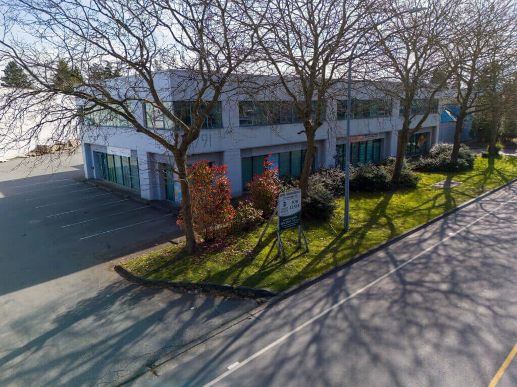 11791 Machrina Way street-level view with For Lease signage and landscaping