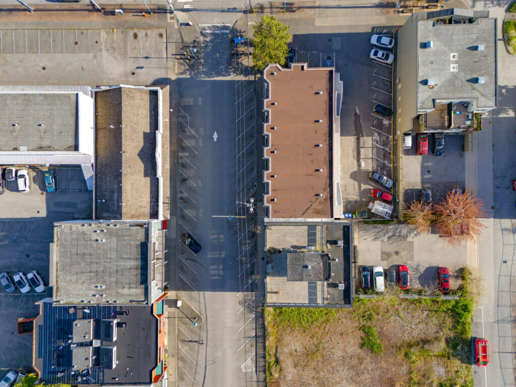 Overhead drone view of 12020 1st Avenue rooftop and adjacent parking in Steveston