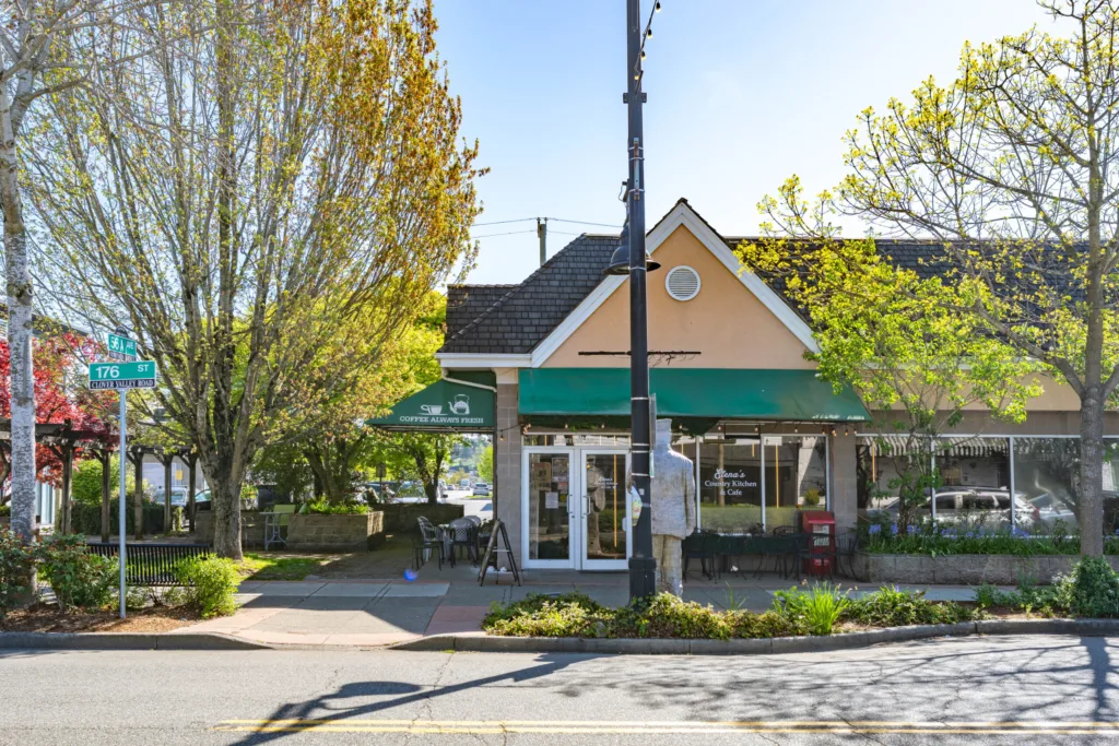 5630 176th Street corner café entrance with green awning on 176th Street