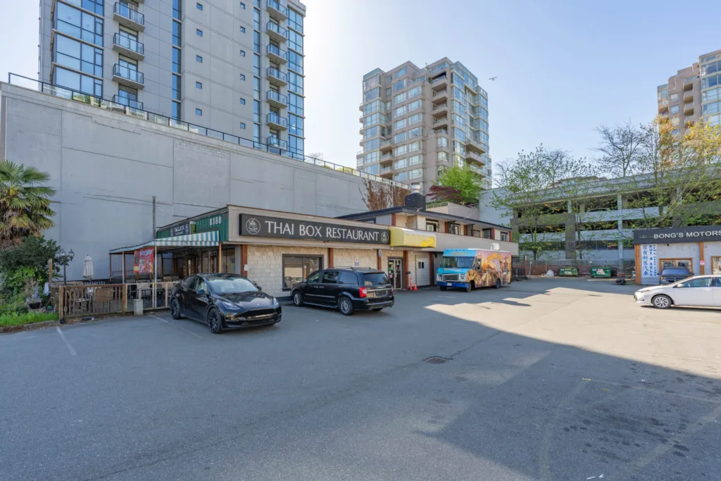 Surface parking lot and retail storefronts at 8120-8180 Westminster Highway Richmond
