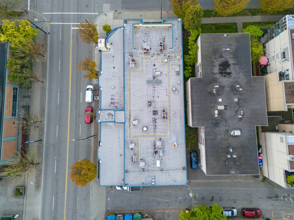 Top-down aerial view of 903 Denman Street rooftop and building footprint
