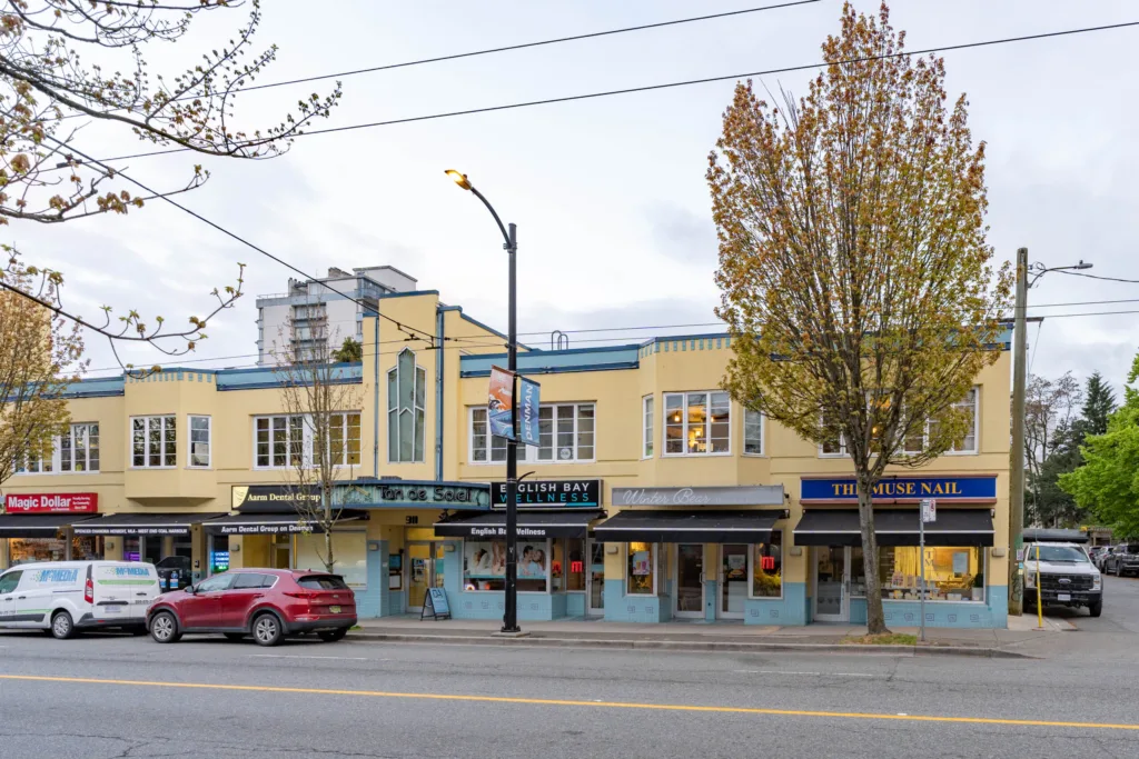 Street-level view of 903 Denman Street retail storefronts and character building facade