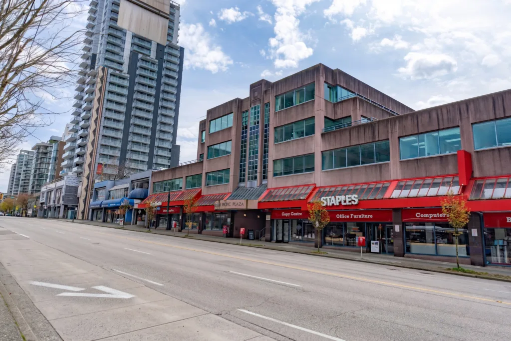 Broadway Pacific Plaza angled street view with neighbouring high-rise towers on West Broadway