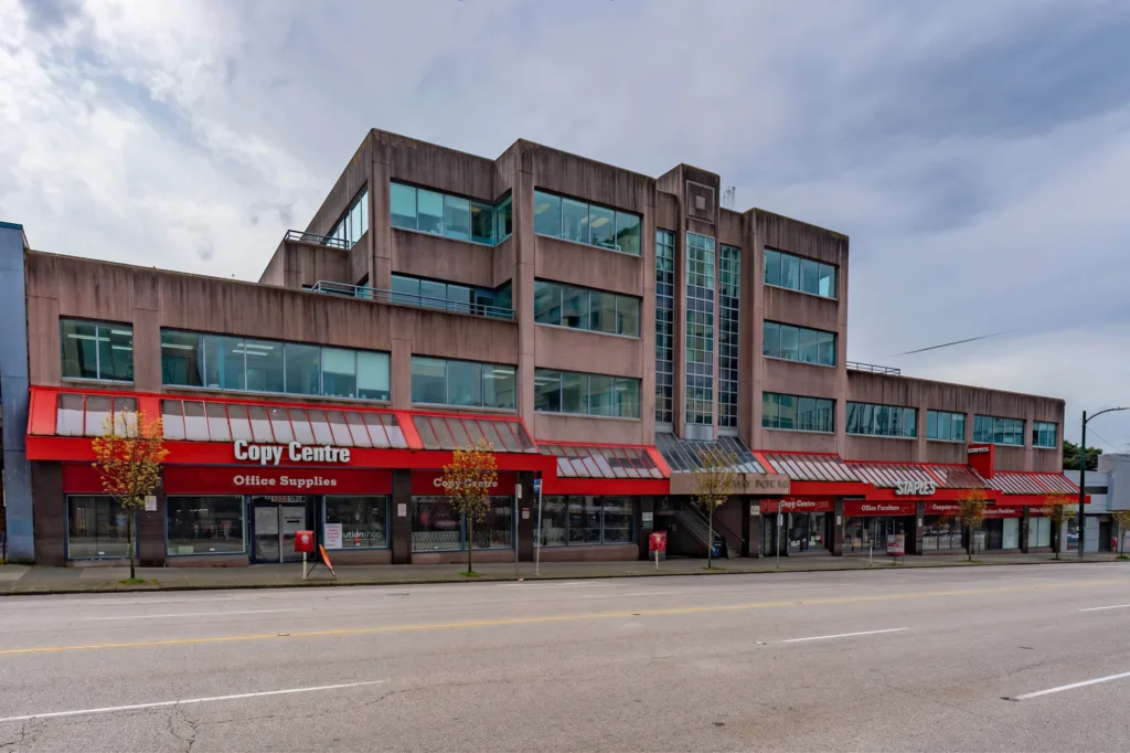 Broadway Pacific Plaza street-level exterior showing ground-floor retail and upper office storeys
