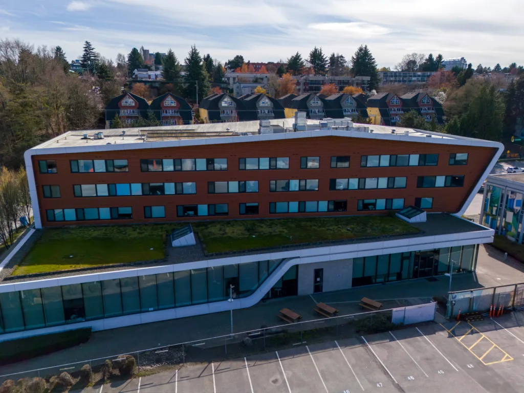 Centre for Digital Media south elevation with parking area and green roof