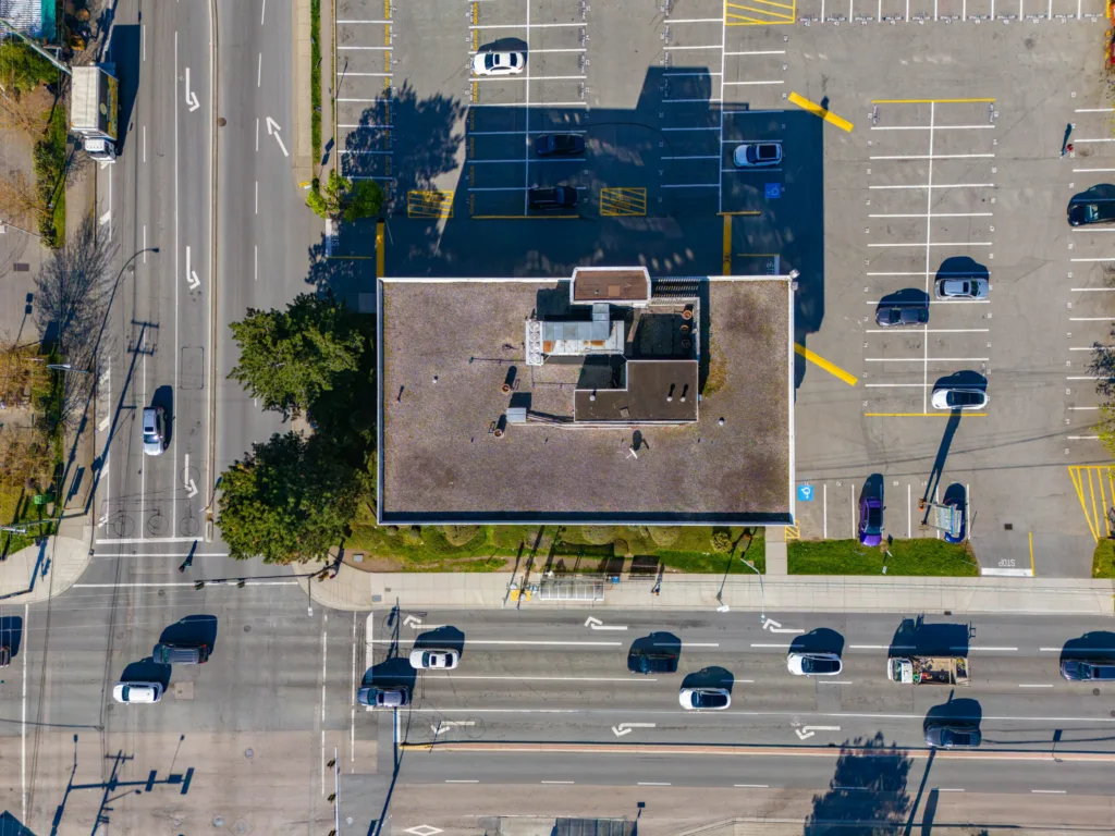 Overhead view of Delta Professional Building rooftop and parking lot at 120th Street intersection
