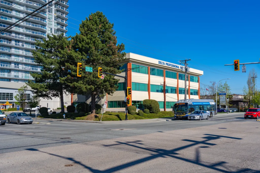 Delta Professional Building at the corner of 120th Street and Scott Road with transit bus