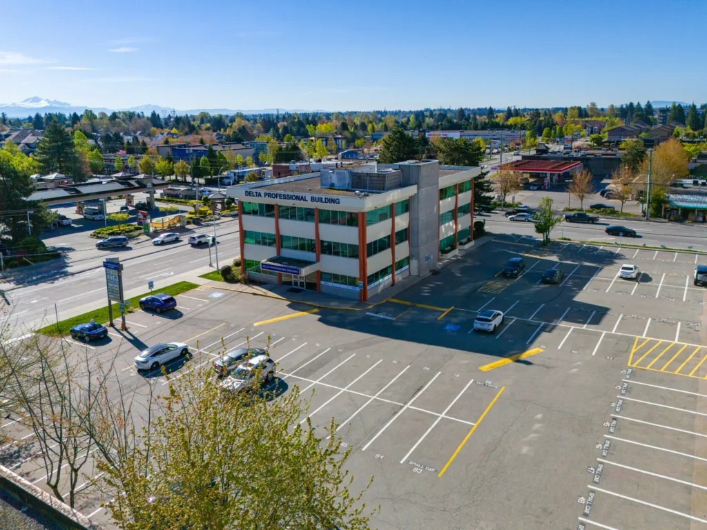Aerial view of Delta Professional Building and surface parking lot in North Delta