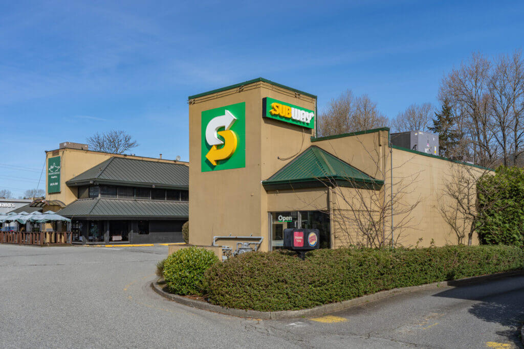 Eagle Ridge Plaza Subway corner entrance and surface parking lot