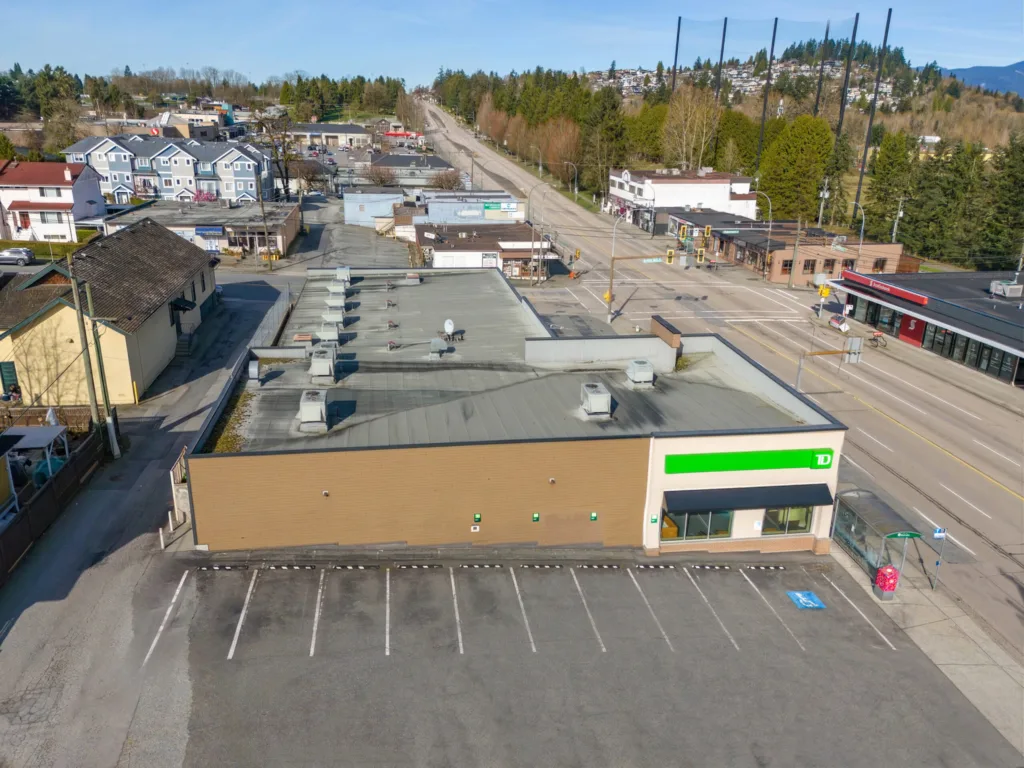 Hastings & Sperling elevated view showing full building footprint, parking lot, and Hastings Street corridor
