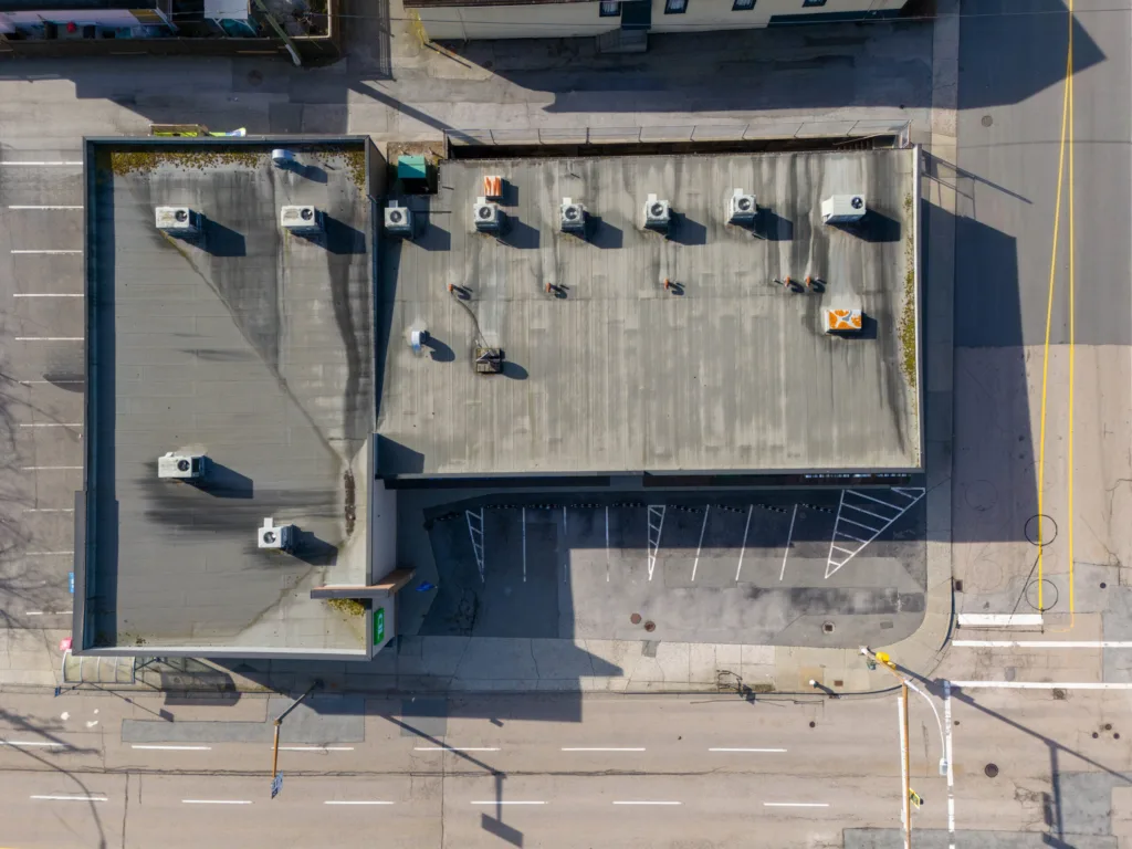 Hastings & Sperling overhead view showing rooftop HVAC units and corner parking layout