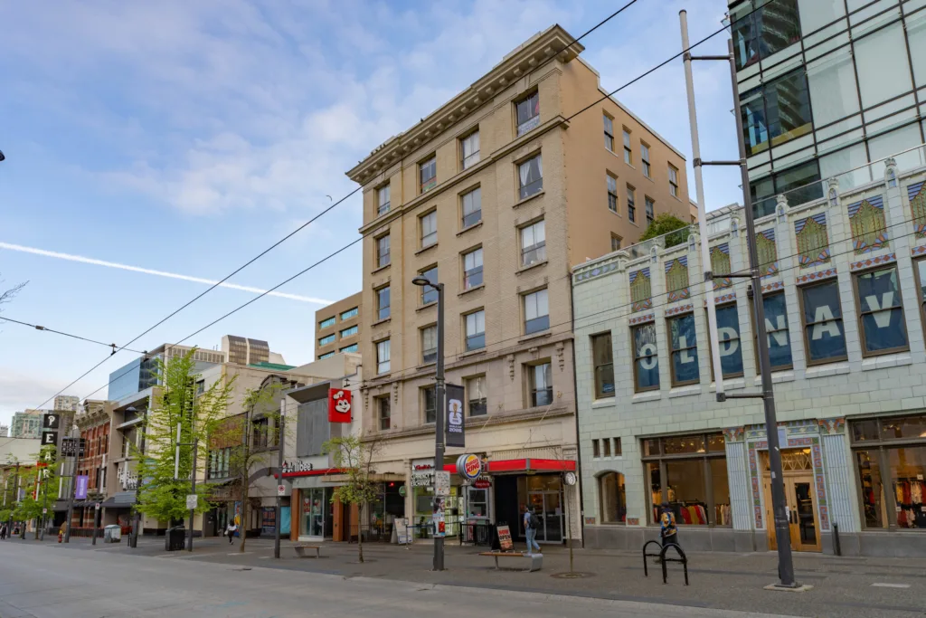 Medical Arts building street view with Old Navy and retail neighbours on Granville Street, Vancouver