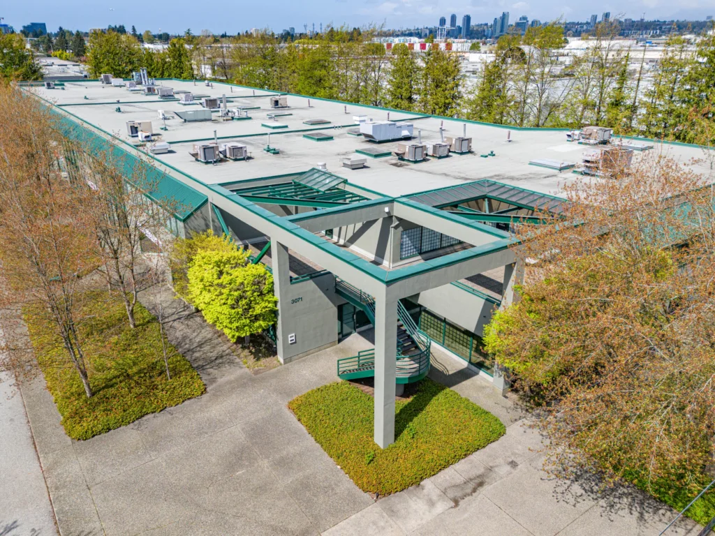 Omnia Centre elevated view showing rooftop HVAC units and entrance canopy