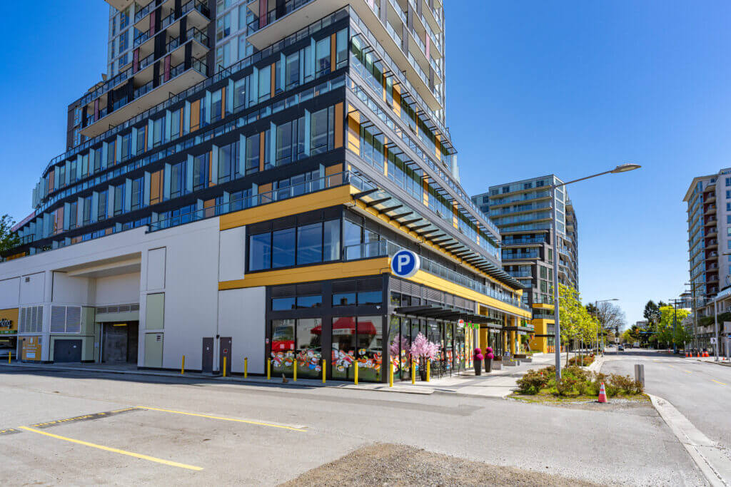 One Park Richmond corner view showing retail podium and parking entrance