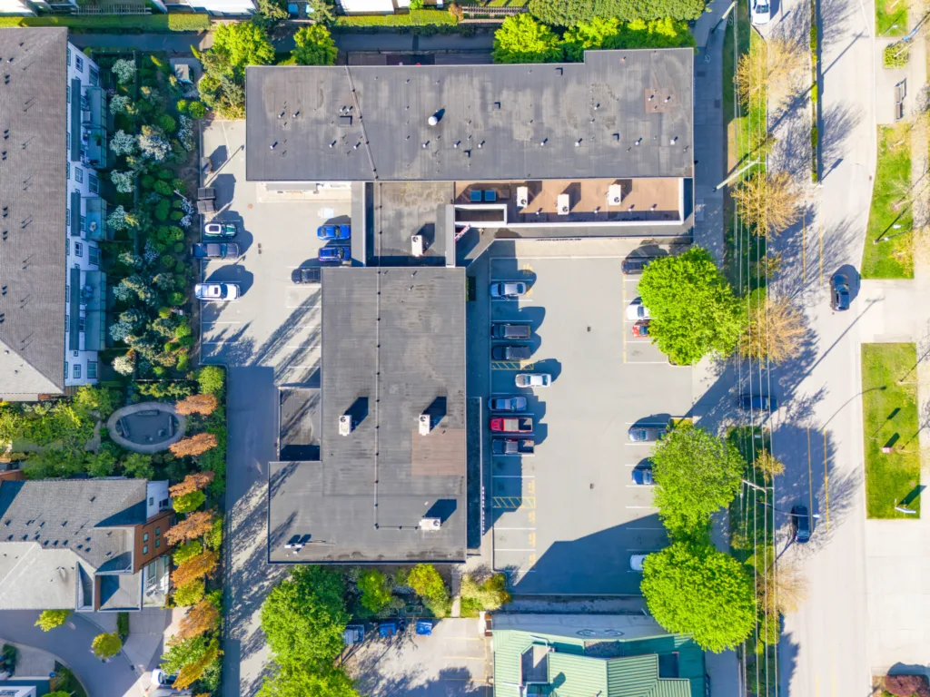 Queens Plaza top-down aerial view of rooftops and surface parking on Ewen Avenue