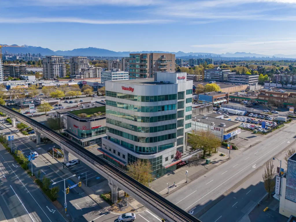 Vancity Tower aerial view showing office tower and retail podium on No. 3 Road, Richmond