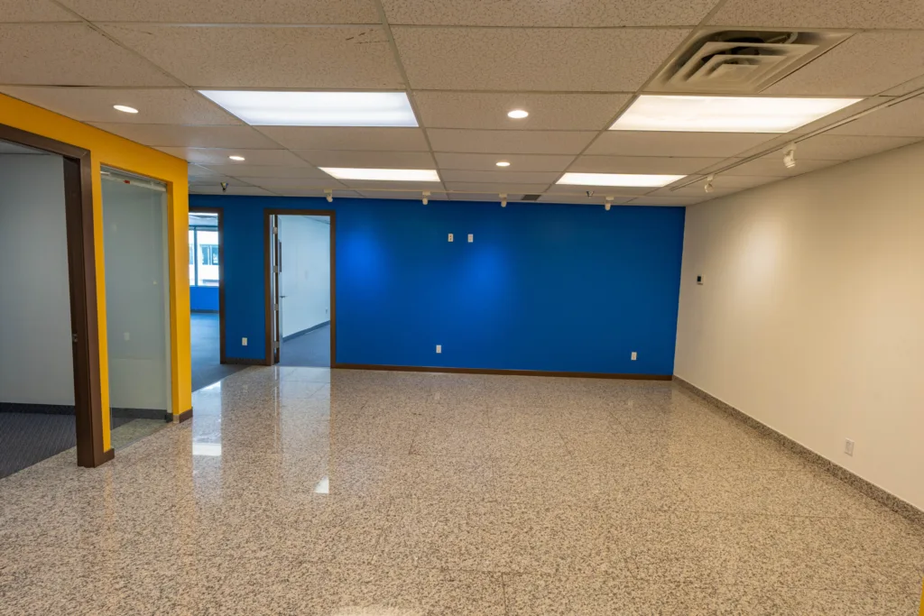 Broadway Pacific Plaza Unit 290 open workspace with blue accent wall