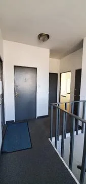 1826-1828 West Broadway Unit 202 second-floor hallway and stairwell landing