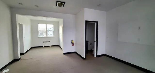 1826-1828 West Broadway Unit 202 open office area with natural light and window