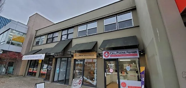 1826-1828 West Broadway building exterior with second-floor office windows and street-level retail