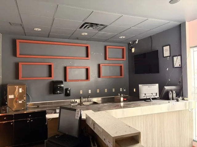8400 Alexandra Road Unit 130 interior reception and counter area at Olympia Centre