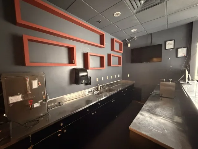 8400 Alexandra Road Unit 130 interior counter with sink and cabinetry