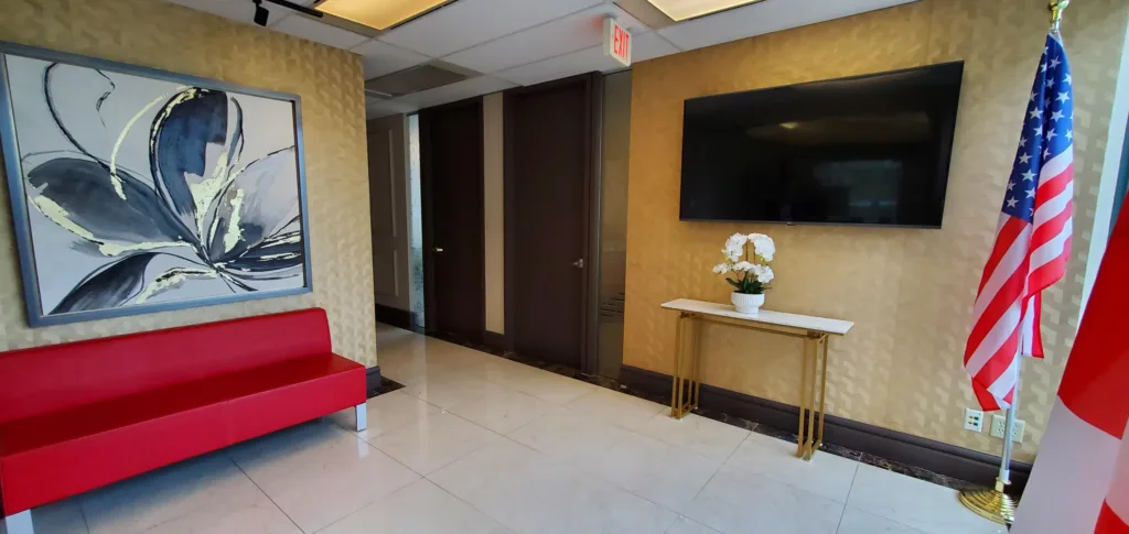 City Square Unit 475 reception lounge with seating and wall-mounted display