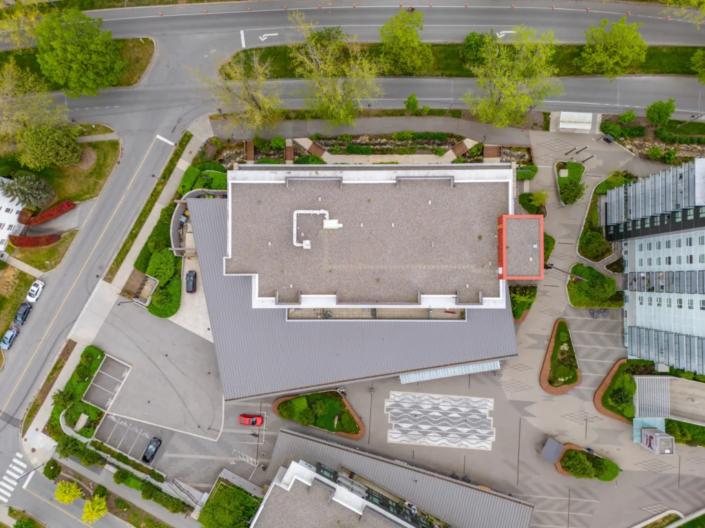 Lelem Village University Blvd Building overhead view showing rooftop and surrounding landscaping