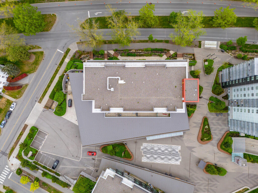 Lelem Village University Blvd Building overhead view showing rooftop and surrounding landscaping
