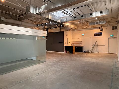 Office space with glass partition and exposed ceiling at 1737 West 3rd Avenue Unit 210