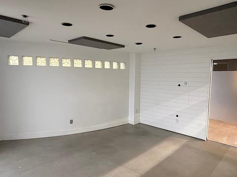 Office room with clerestory windows and white walls at 1737 West 3rd Avenue Unit 210