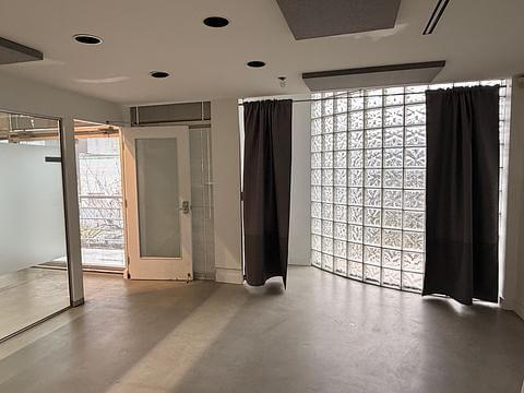 Private office with glass block wall and curtains at 1737 West 3rd Avenue Unit 210