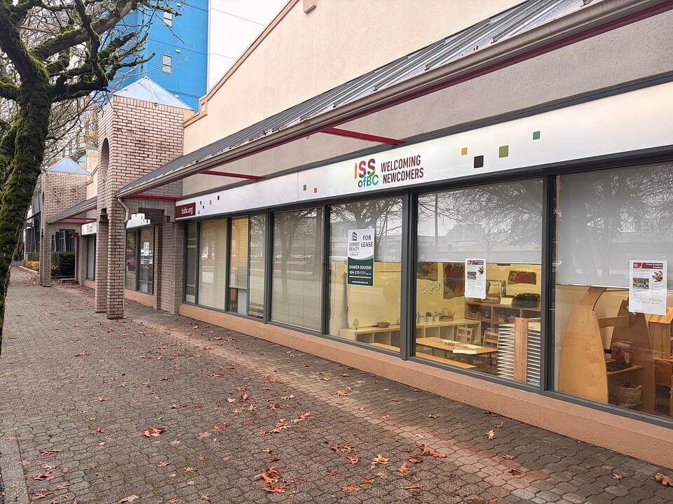 Exterior street view of Unit 150 at 8400 Alexandra Road with For Lease signage