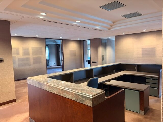 L-shaped reception counter and workstation in Unit 220 at 4800 No 3 Road