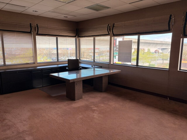 Corner office with large windows and desk at 4800 No 3 Road Unit 220