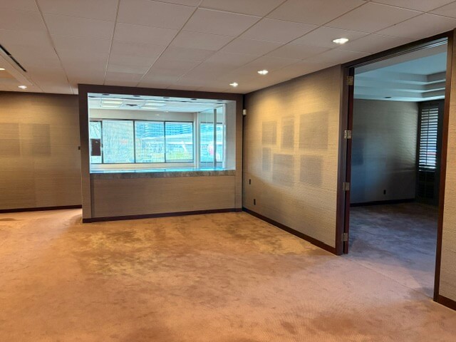 Open office room with window and glass partition in Unit 220 at 4800 No 3 Road