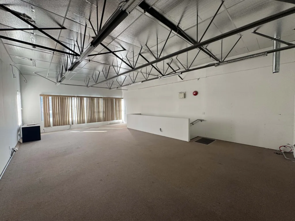 11568 Eburne Way Unit 125 upper level open workspace with exposed trusses