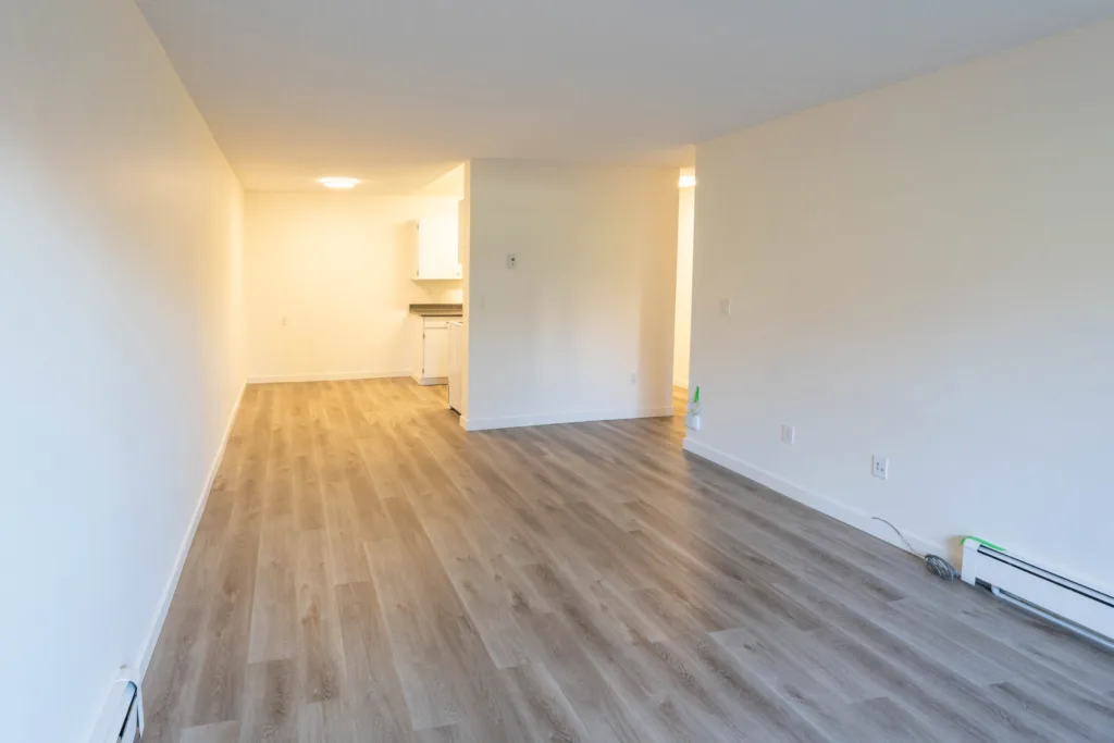 Kitchen and living space overview in Unit 201 at Charles Manor Charles St