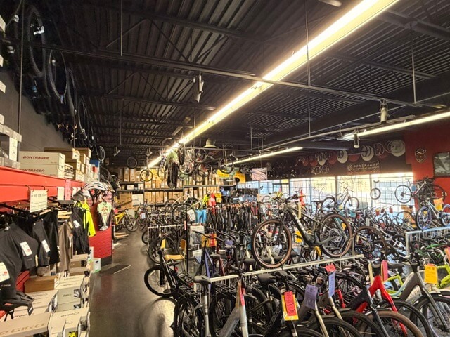 Interior retail floor with bicycles on display at 8400-8460 Alexandra Road Unit 135
