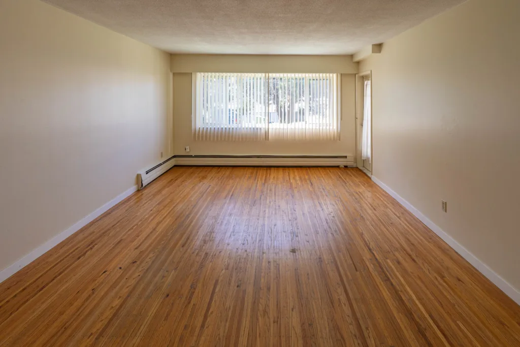 Living room with hardwood floors and large window at 7175 Pandora Street Unit 22