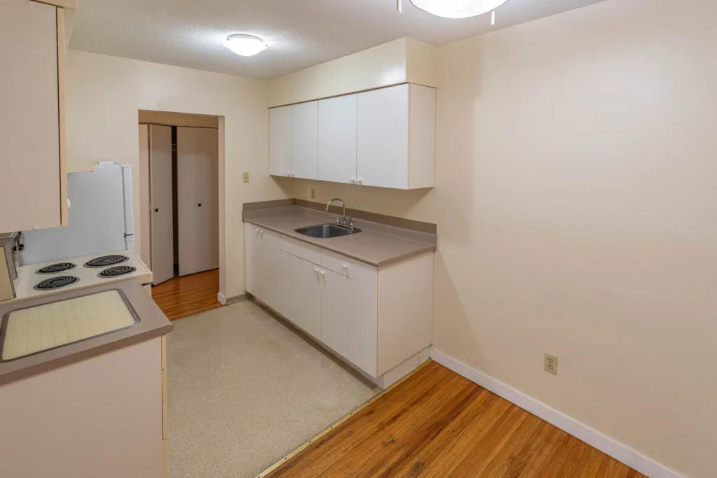 Kitchen with white cabinets and stove at 7175 Pandora Street Unit 22