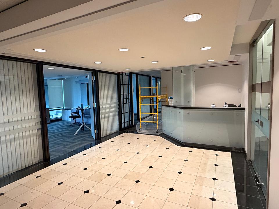 Reception area with glass partitions in office Unit N412 at 5811 Cooney Road