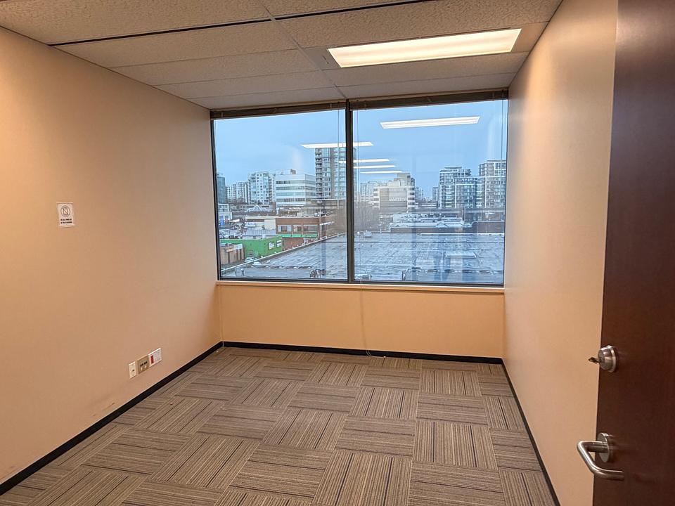 Private office with city view window at 5811 Cooney Road Unit S403