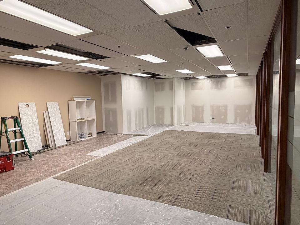 Office renovation in progress at 5811 Cooney Road Unit S403 showing open floor area