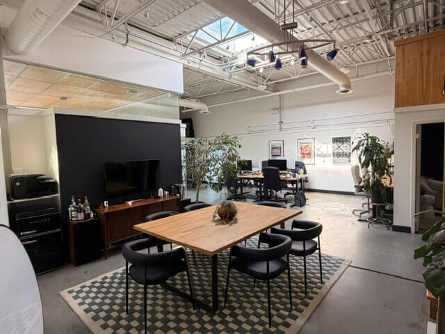 Spacious office workspace with skylight and open layout at 1737 West 3rd Avenue Unit 212