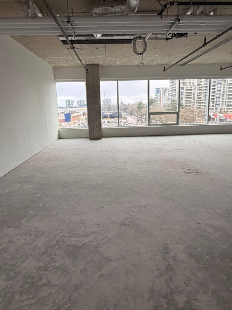 Open-plan office space with floor-to-ceiling windows at 5599 No. 3 Road Unit 525, Richmond