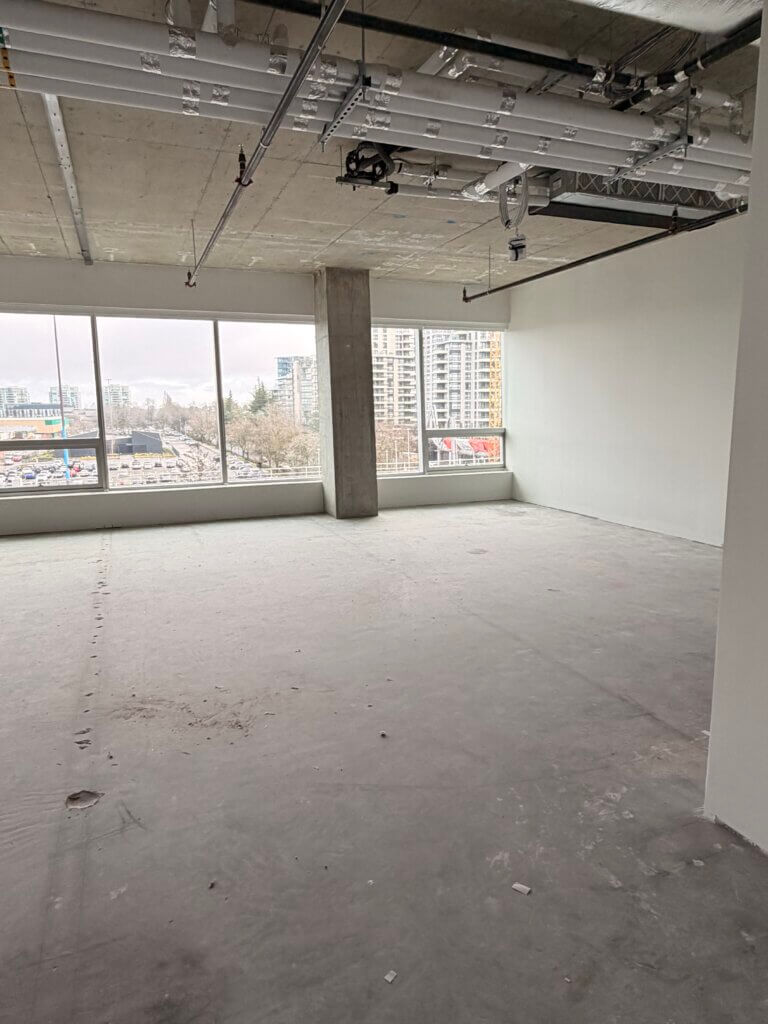 Open-plan office interior with floor-to-ceiling windows at 5599 No. 3 Road Unit 530