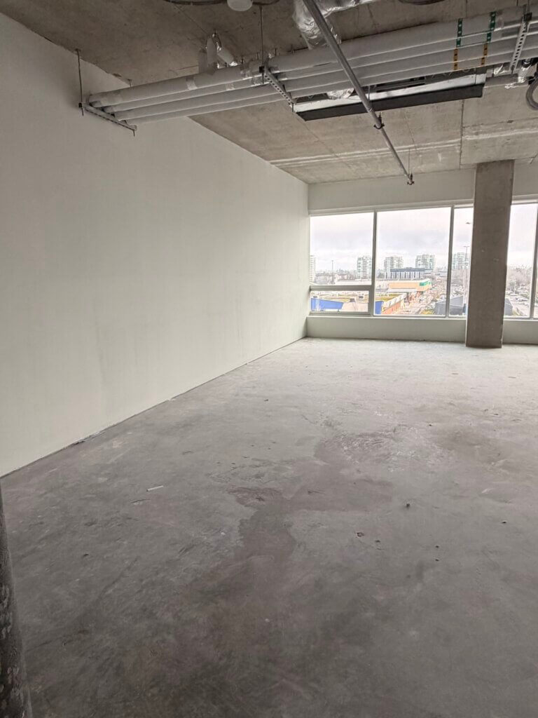Open-plan office interior with east-facing windows at 5599 No. 3 Road Unit 715