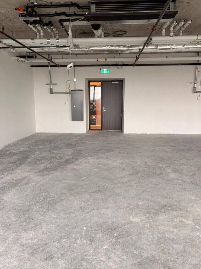 Office unit entrance and concrete floor at 5599 No. 3 Road Unit 725, Richmond